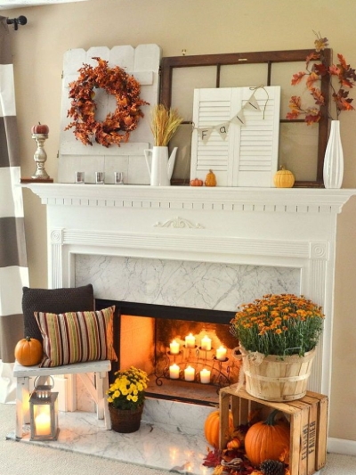 Fall-fireplace-decorating-idea-with-leaves-pumpkins-and-flowers-